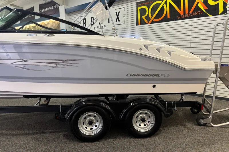 Slide: The Image of 2026 Chaparral 21 SSi Ski & Fish boat on trailer in showroom. - 19