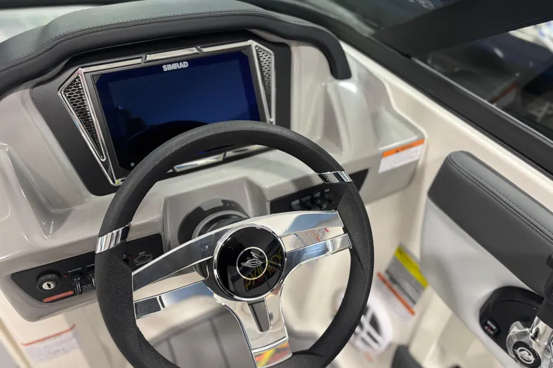 Slide: The Image of Steering wheel and dashboard of Chaparral 21 SSi Ski & Fish 2026. - 13