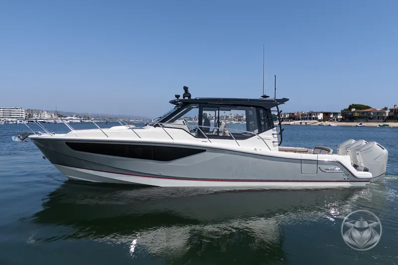 Slide: The Image of 2025 Boston Whaler 405 Conquest boat on calm water, showcasing sleek design and modern features. - 11