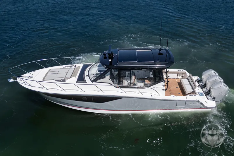 Slide: The Image of 2025 Boston Whaler 405 Conquest boat cruising on open water, showcasing sleek design and powerful engines. - 20