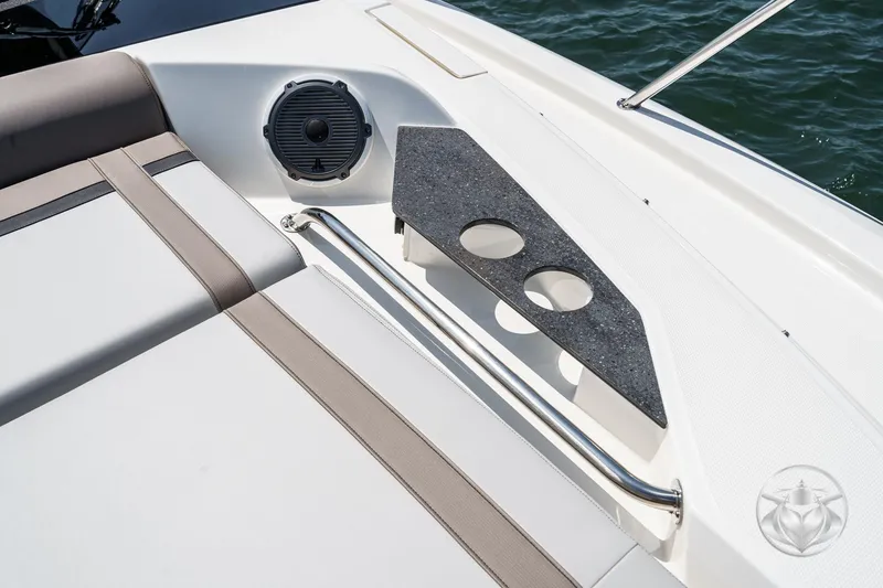 Slide: The Image of Boston Whaler 405 Conquest 2025 boat interior with speaker and cup holders. - 24
