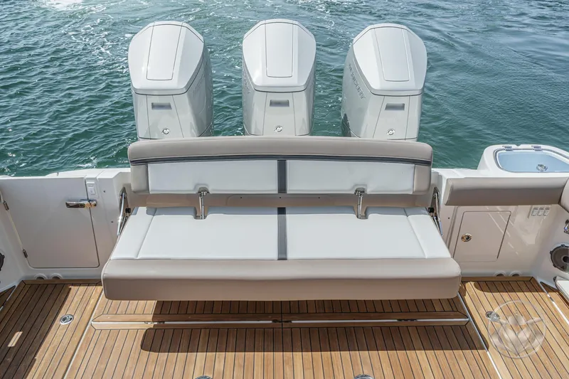 Slide: The Image of 2025 Boston Whaler 405 Conquest boat with triple engines and teak deck. - 29
