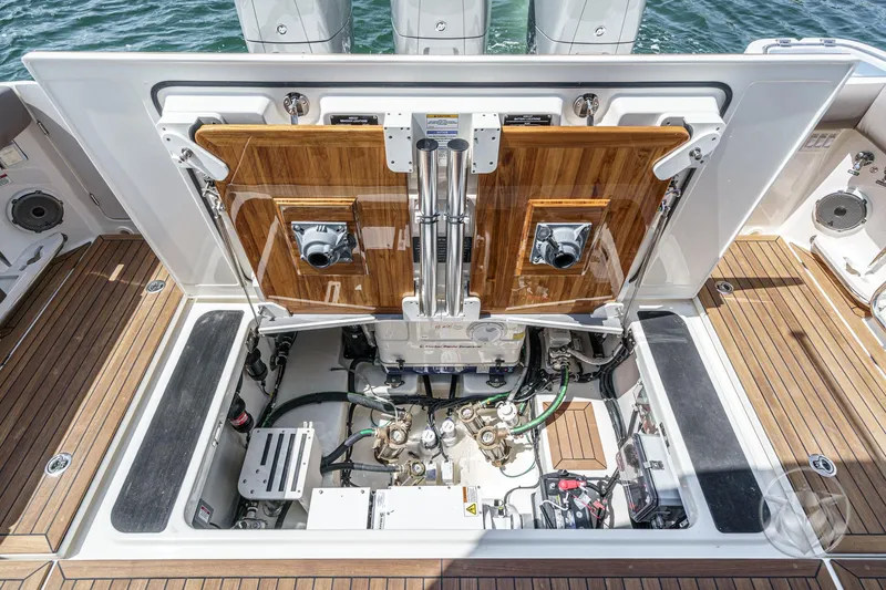 Slide: The Image of Engine compartment of 2025 Boston Whaler 405 Conquest, showcasing detailed mechanical components. - 34