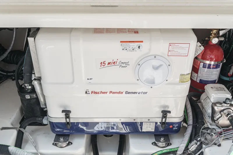 Slide: The Image of Fischer Panda generator in 2025 Boston Whaler 405 Conquest boat engine compartment. - 35