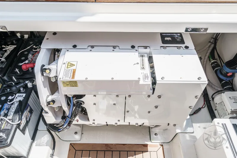 Slide: The Image of Engine compartment of 2025 Boston Whaler 405 Conquest, featuring advanced mechanical components. - 36