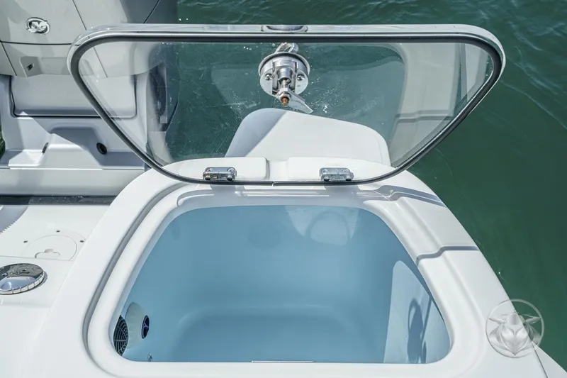 Slide: The Image of Open storage compartment on 2025 Boston Whaler 405 Conquest boat, near water. - 41