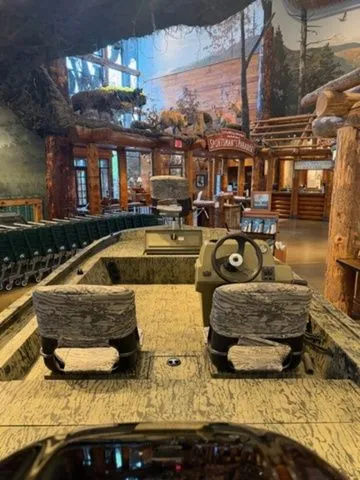Slide: The Image of 2026 Grizzly G1754SC boat in rustic showroom setting. - 5