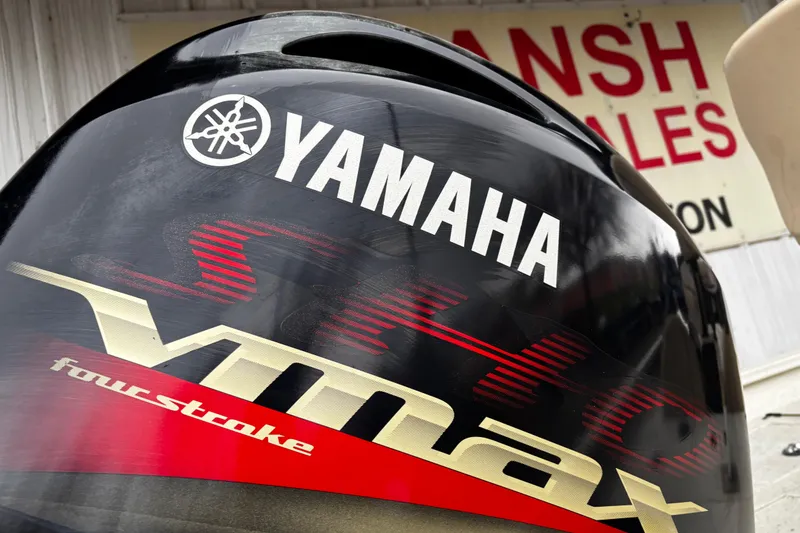 Slide: The Image of 2021 Xpress X18PFC boat with Yamaha outboard motor on a trailer. - 12