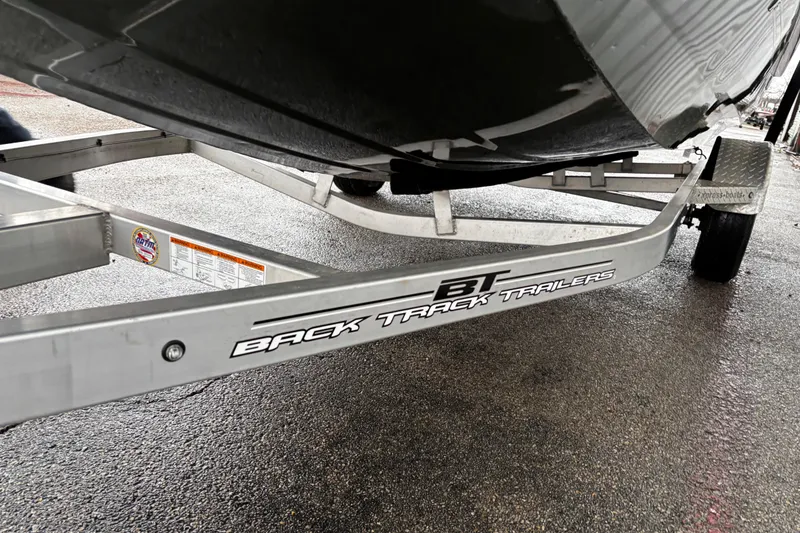 Slide: The Image of 2021 Xpress X18PFC boat with Yamaha 115 outboard motor on trailer. - 19