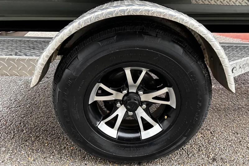 Slide: The Image of 2021 Xpress X18PFC boat engine detail with caution label and speckled surface. - 26