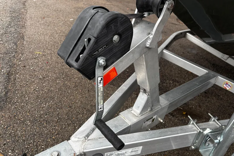 Slide: The Image of 2021 Xpress X18PFC boat rear view with motor and trailer attachment. - 27