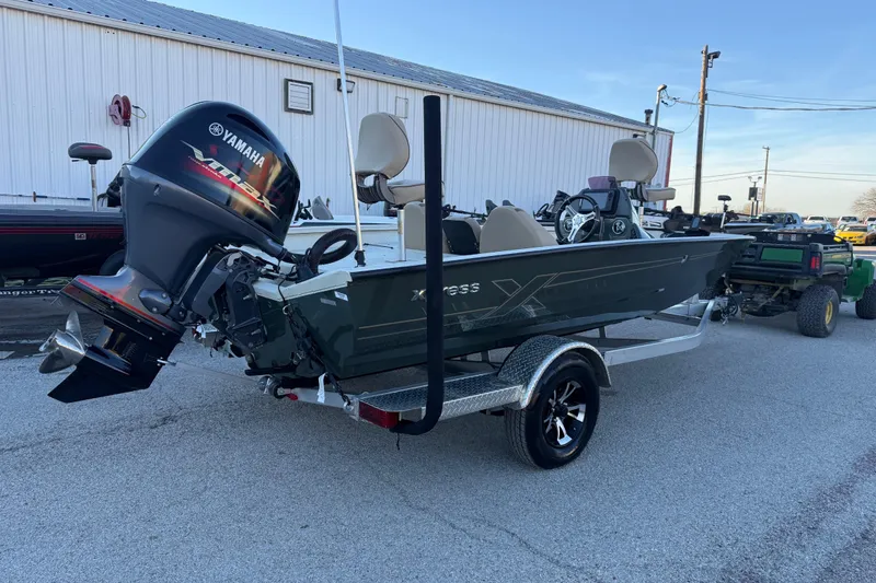 Slide: The Image of 2021 Xpress X18PFC boat with Yamaha outboard motor on a trailer. - 30