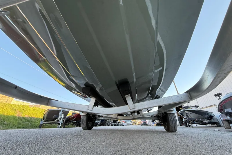 Slide: The Image of Underneath view of 2021 Xpress X18PFC boat on a trailer in a parking lot. - 40