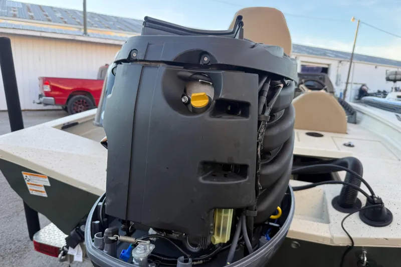 Slide: The Image of 2021 Xpress X18PFC boat engine with open cover, showing internal components. - 46