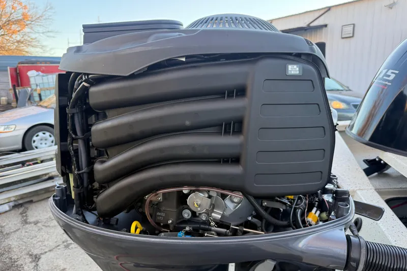 Slide: The Image of 2021 Xpress X18PFC boat engine close-up, showcasing intricate mechanical components. - 48