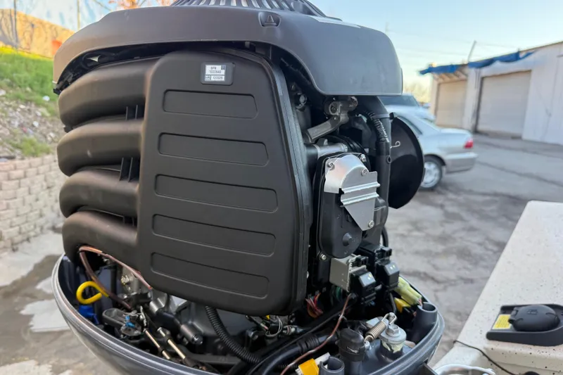 Slide: The Image of 2021 Xpress X18PFC outboard motor, detailed view of engine components. - 49