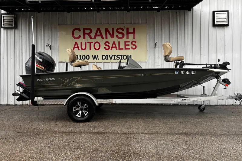 The Image of 2021 Xpress X18PFC boat on trailer in outdoor setting. - 6