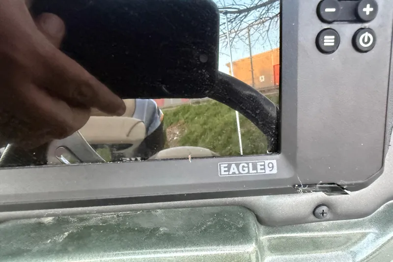 Slide: The Image of Close-up of a 2021 Xpress X18PFC boat dashboard with Eagle9 display. - 64