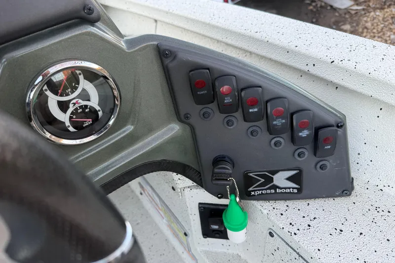Slide: The Image of Control panel of 2021 Xpress X18PFC boat with gauges and switches. - 65