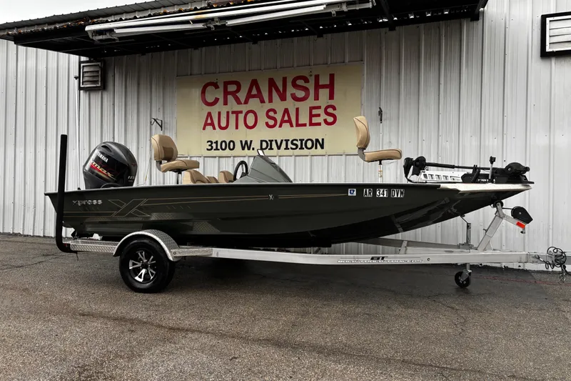 Slide: The Image of 2021 Xpress X18PFC fishing boat on trailer, parked outdoors. - 8