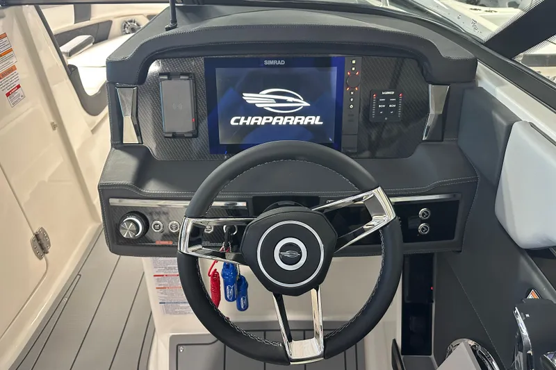 Slide: The Image of 2026 Chaparral SSX 8 boat dashboard with steering wheel and digital display. - 11