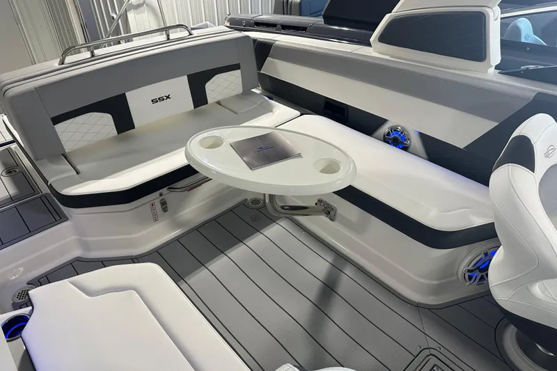 Slide: The Image of 2026 Chaparral SSX 8 boat interior with sleek seating and modern design. - 12