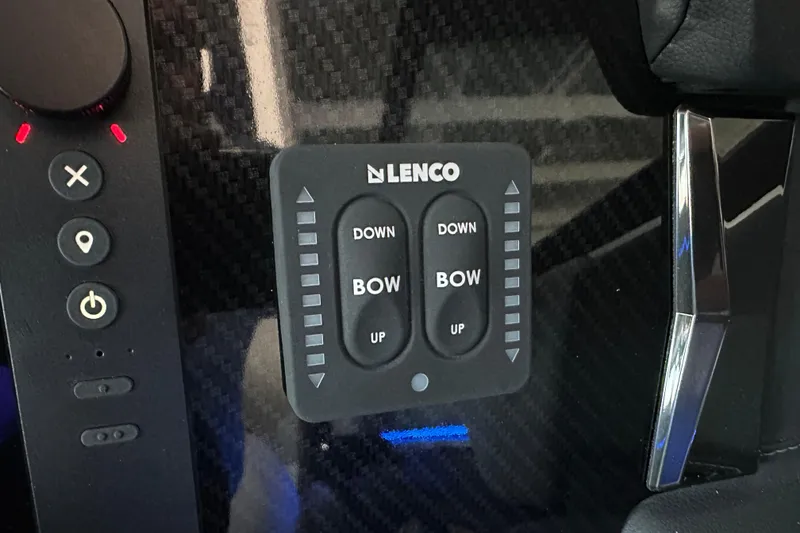 Slide: The Image of 2026 Chaparral SSX 8 Lenco bow control panel with carbon fiber finish. - 24