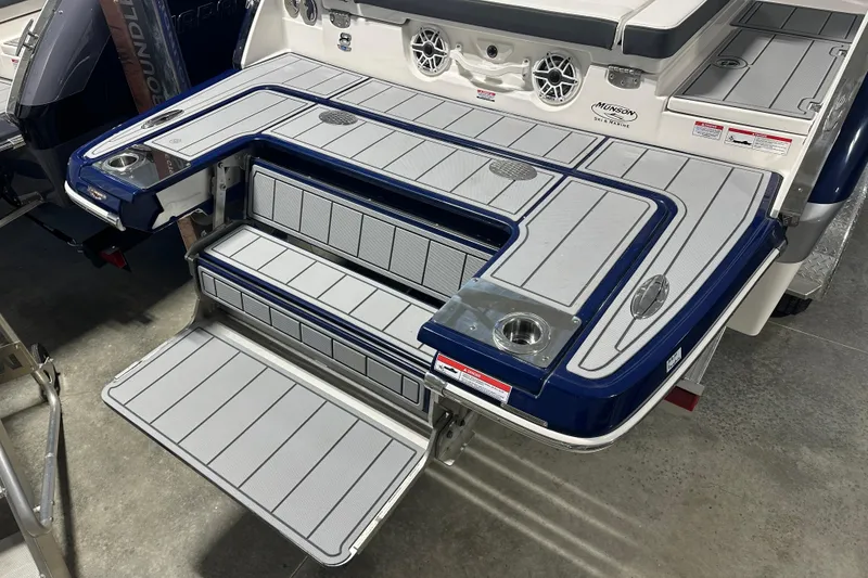 Slide: The Image of 2026 Chaparral SSX 8 boat swim platform with integrated speakers and cup holders. - 7