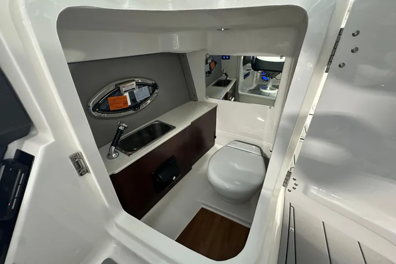 Slide: The Image of Interior of 2026 Chaparral SSX 8 with toilet and sink. - 14