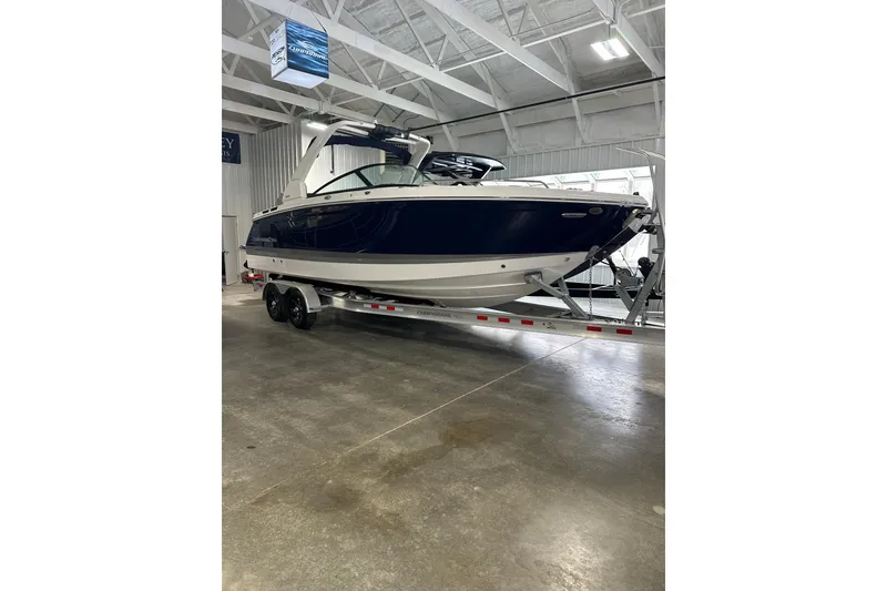 Slide: The Image of 2026 Chaparral SSX 8 boat on trailer in indoor facility. - 3