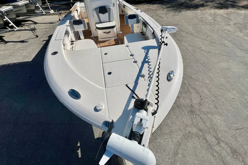 Slide: The Image of 2023 Robalo 266 Cayman boat, front deck view with seating and equipment. - 6