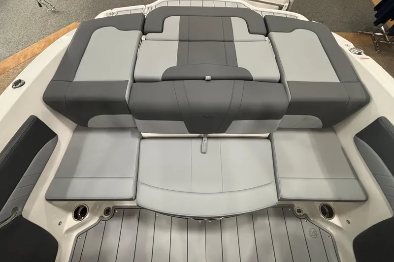 Slide: The Image of 2026 Chaparral 21 SSi boat interior with gray cushioned seating and sleek design. - 14