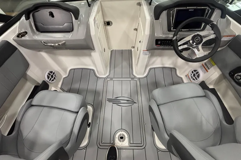 Slide: The Image of 2026 Chaparral 21 SSi boat interior with modern dashboard and seating. - 17