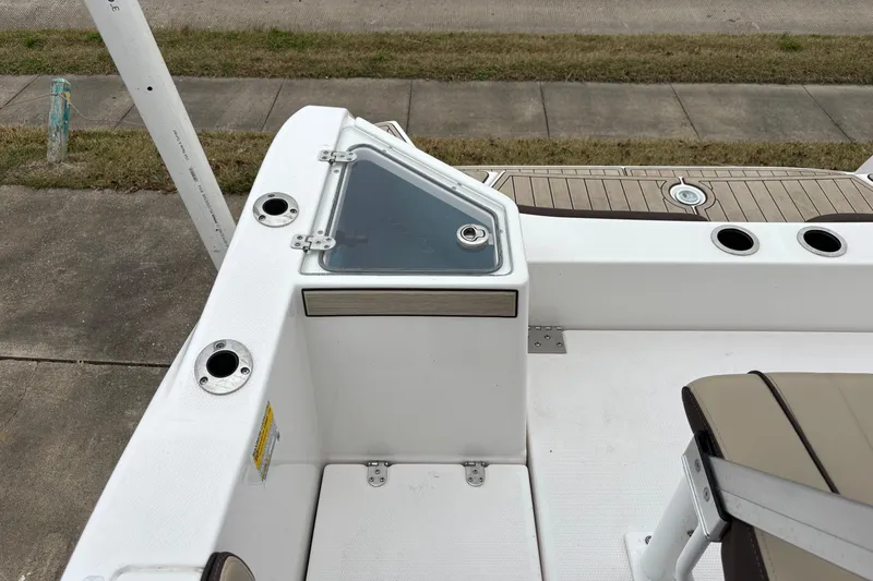 Slide: The Image of 2023 Yamaha Boats 222 FSH Sport deck with seating and rod holders. - 14