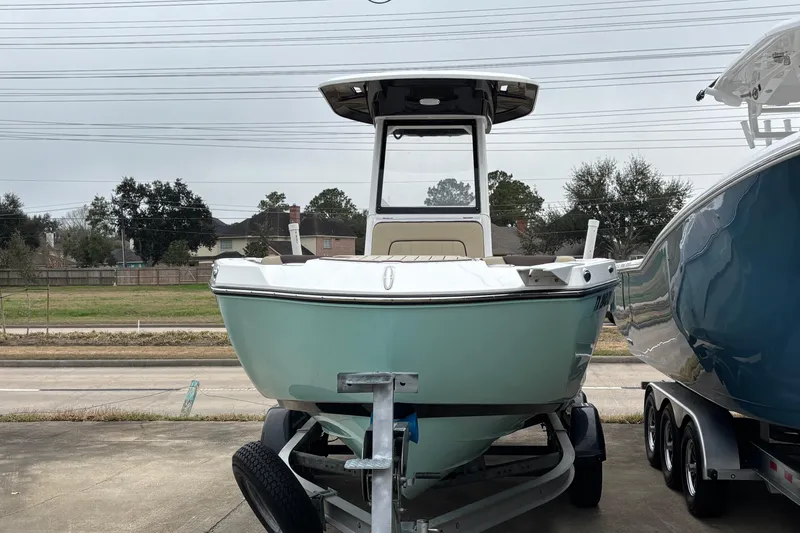 Slide: The Image of 2023 Yamaha Boats 222 FSH Sport on trailer, parked outdoors. - 19