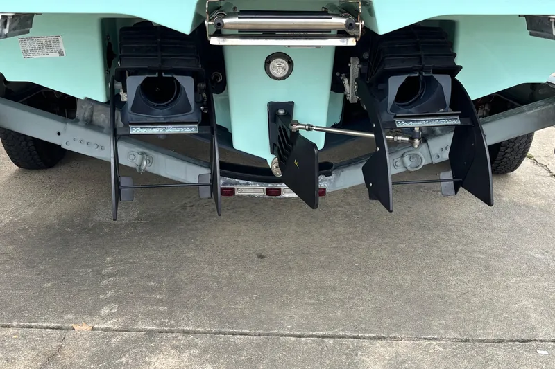 Slide: The Image of Rear view of 2023 Yamaha Boats 222 FSH Sport jet propulsion system on trailer. - 20