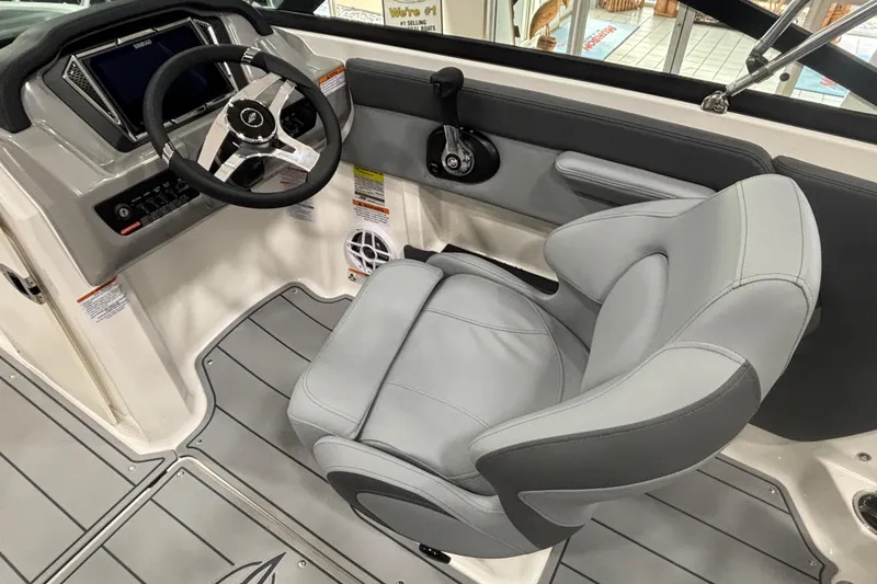 Slide: The Image of 2026 Chaparral 21 SSi interior with gray seat and steering wheel. - 9
