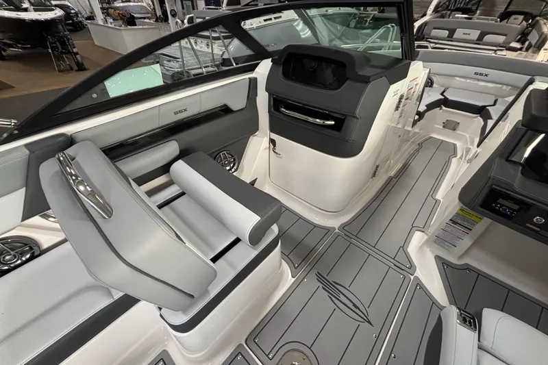 Slide: The Image of 2026 Chaparral SSX 4 boat interior with sleek seating and modern dashboard design. - 11