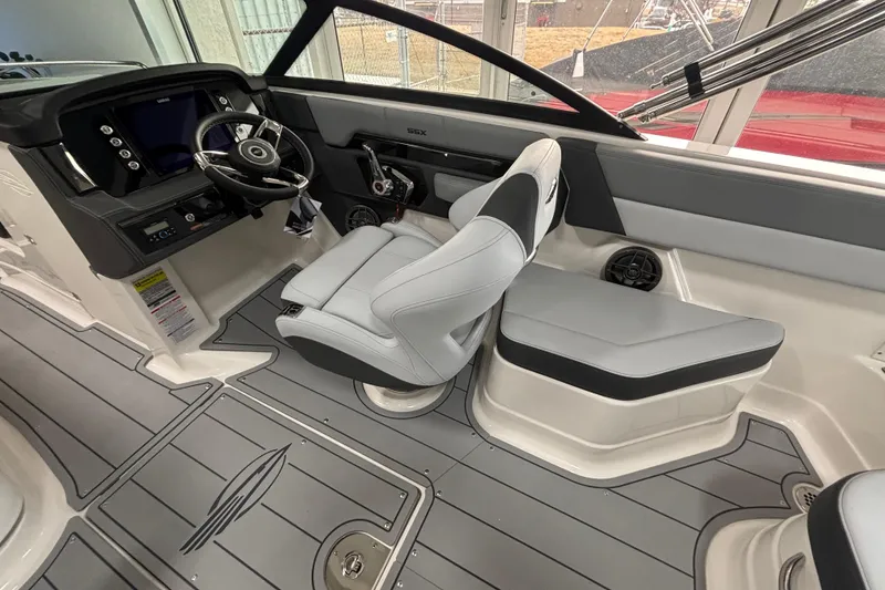 Slide: The Image of 2026 Chaparral SSX 4 boat interior with modern helm and seating. - 14