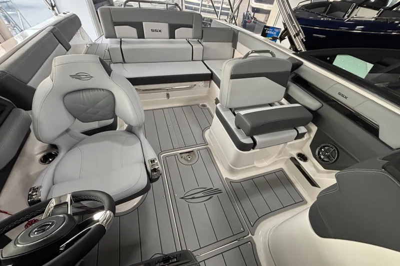 Slide: The Image of 2026 Chaparral SSX 4 boat interior with sleek gray seating and modern design. - 21