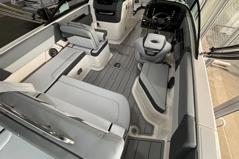 Slide: The Image of 2026 Chaparral SSX 4 boat interior with sleek seating and modern dashboard design. - 9