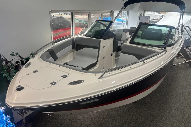 Slide: The Image of 2026 Chaparral SSX 4 boat in showroom. - 25