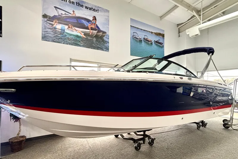 Slide: The Image of Chaparral SSX 4 2026 boat in showroom with promotional images. - 27