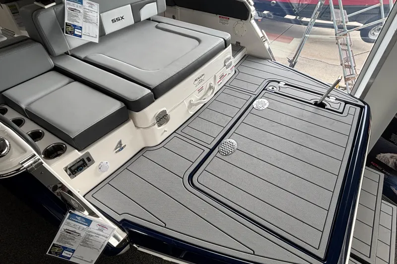 Slide: The Image of 2026 Chaparral SSX 4 boat with gray deck and seating area. - 5