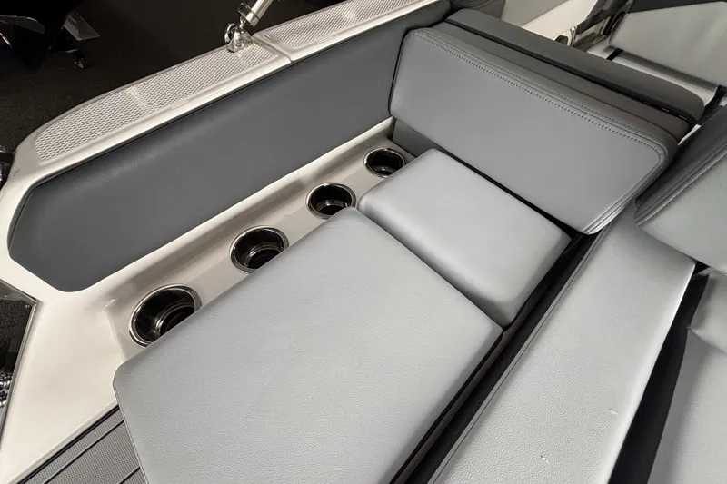 Slide: The Image of Interior of 2026 Chaparral SSX 4 with gray upholstery and cup holders. - 8