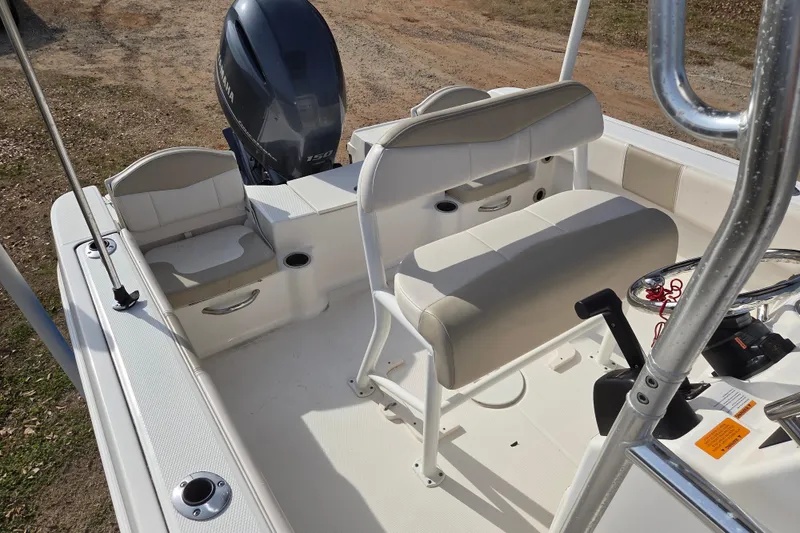 Slide: The Image of 2017 Robalo R180 Center Console boat interior with seating and Yamaha engine. - 12