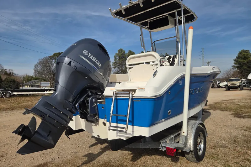 Slide: The Image of 2017 Robalo R180 Center Console boat with Yamaha outboard engine on trailer. - 4