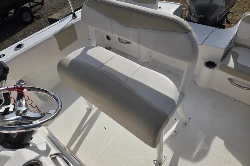 Slide: The Image of 2017 Robalo R180 Center Console boat interior with steering wheel and seating. - 7