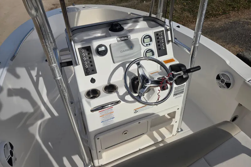 Slide: The Image of 2017 Robalo R180 Center Console boat dashboard with Garmin navigation system. - 9