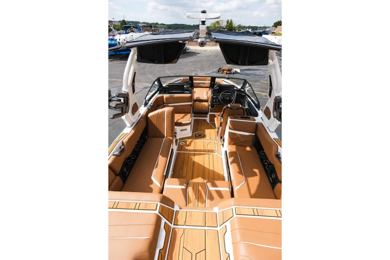 Slide: The Image of 2026 Supra SL boat interior with luxurious tan seating and sleek design. - 16